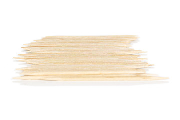 Lot of whole wooden brown toothpick isolated on white background