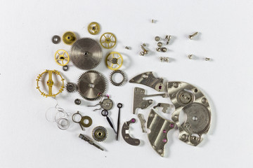 Spare parts from mechanical watches on a white background