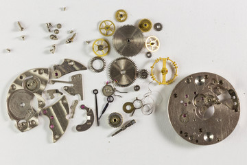 Spare parts from mechanical watches on a white background
