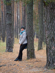 girl in a pine forest in autumn outdoors