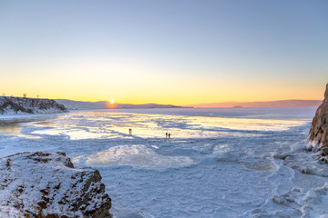 Colorful sunset over the crystal ice of Baikal lake