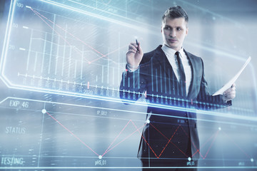 Fototapeta premium Businessman standing with business theme hologram. Multi exposure. Concept of analysis