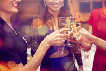 New Year eve party with champagne. Woman's celebrating and toasting with champagne flutes