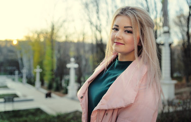 Fototapeta premium A portrait of a beautiful girl, walking in the autumn park.
