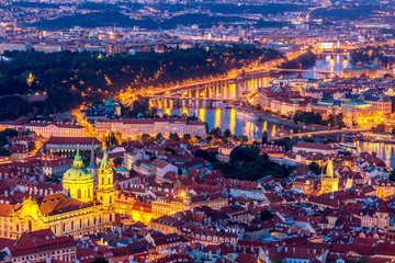 Illuminated Prague at twilight blue hour. VIew from Petrin hill