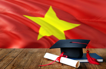 Vietnam education concept. Graduation cap and diploma on wooden table, national flag background. Succesful student.