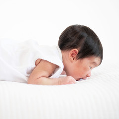 newborn baby sleep in bed on white background