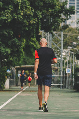 runner on the street be running for exercise; sport, people, exercising and lifestyle concept