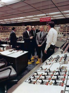 Wearing yellow plastic boots to protect against nuclear contamination President Jimmy Carter visits the Control Room of Three Mile Island Nuclear Generating Station four days after the partial meltdown of Unit 2 reactor
