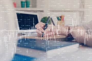 Financial graph displayed on woman's hand taking notes background. Concept of research. Double...