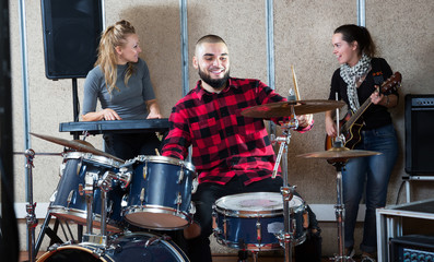 Garage band rehearsing in studio