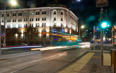 Fototapeta na wymiar The motion of a blurred tram in the evening.