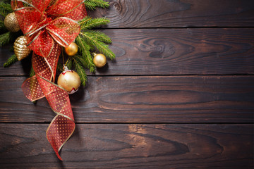golden and red Christmas  decorations on dark wooden background