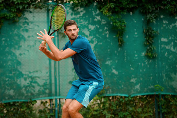 Portrait of a tennis player in action.