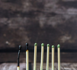 colored matches on wooden background