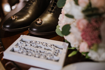 Wedding rings with decorations on wedding day preparations