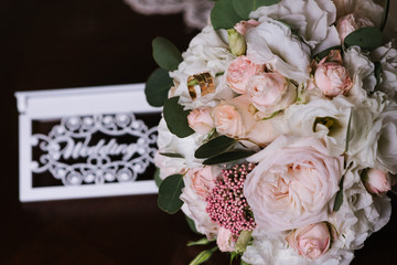 Beautiful wedding bouquet with fresh flowers on a wedding day