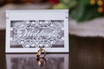 Wedding rings with decorations on wedding day preparations