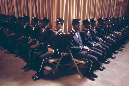 The Fruit of Islam body guards for Elijah Muhammad sit in formation while the leader delivers his annual Savior s Day message in Chicago