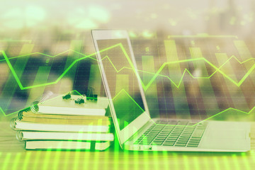 Fototapeta premium Stock market graph and table with computer background. Multi exposure. Concept of financial analysis.