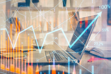 Forex market graph hologram and personal computer on background. Double exposure. Concept of investment.