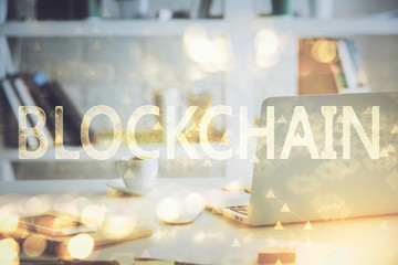 Multi exposure of blockchain theme hologram and table with computer background. Concept of bitcoin crypto currency.