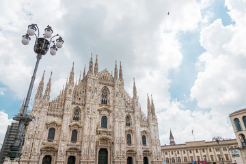 Naklejka premium MILAN, ITALY - May 29, 2018: street view of Milan Cathedral, Dome de Milan is the cathedral church