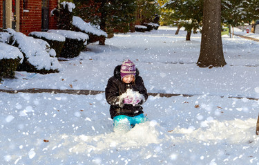 Fototapeta na wymiar Winter lovely girl has a fun in snow