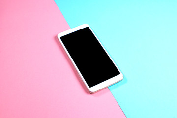 white phone with black screen for your lettering on blue and pink background