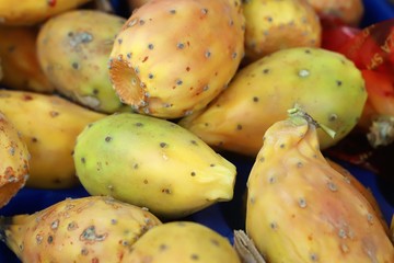 close up of prickly pears on display at the market