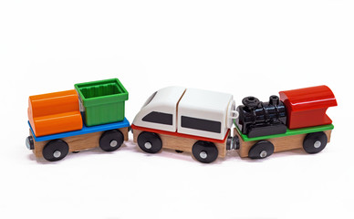 Wooden toy cars on a white background.