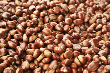 closeup of chestnuts on display at the market