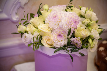 flower arrangement in silver bowl with pink and white roses