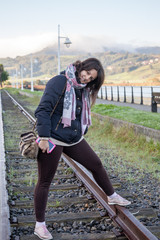 girl on railroad tracks