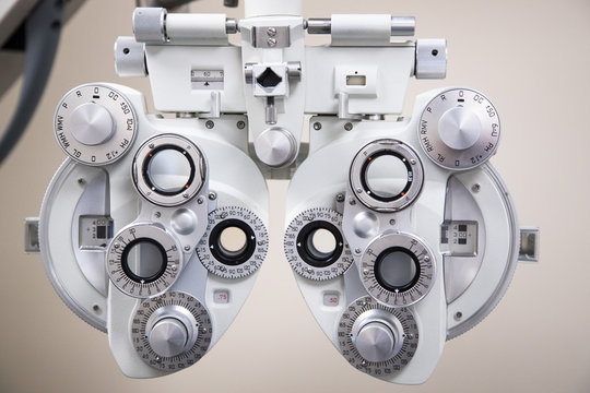 close up on eyesight testing equipment in an Optometrists office, optical phoropter background