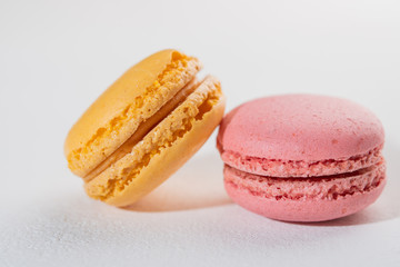 Macarons pattern on white background. Colorful french desserts. Close up