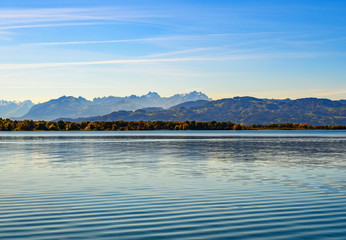 Panorama of lake Constance and alpine peaks on autumn.