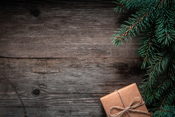 Christmas green frame from fir branches on a vintage gray board background. Frame of fir branches. Christmas card blank.