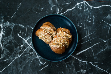 Turkish Dessert Hayrabolu with Sherbet, Tahin, Cheese and Hazelnut Powder.