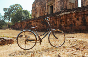 Fototapeta na wymiar Classic vintage Bicycle in Angkor Wat temple Cambodia