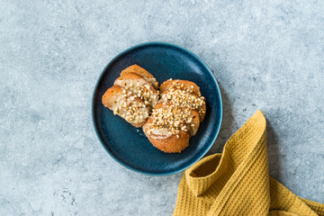 Turkish Dessert Hayrabolu with Sherbet, Tahin, Cheese and Hazelnut Powder.
