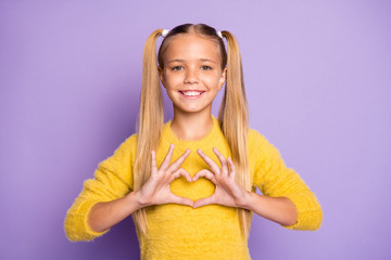 Photo of cheerful positive girl smiling toothily stylish trendy showing heart shape sign with fingers isolated pastel violet color background