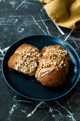 Turkish Dessert Hayrabolu with Sherbet, Tahin, Cheese and Hazelnut Powder.