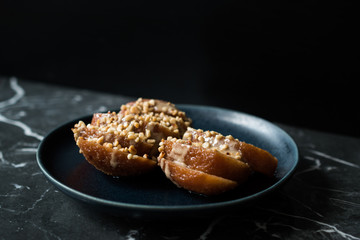 Turkish Dessert Hayrabolu with Sherbet, Tahin, Cheese and Hazelnut Powder.