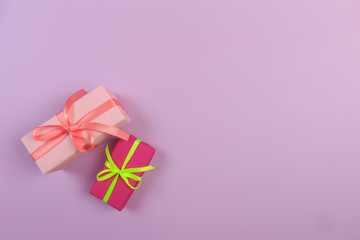 Different colored gift box on color background. Top view of various present boxes on minimal background. Birthday, Christmas, wedding, valentine, romantic gifts - Image