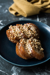 Turkish Dessert Hayrabolu with Sherbet, Tahin, Cheese and Hazelnut Powder.