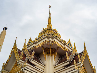 Fototapeta premium Crematory architecture style Thai with details texture is beautiful golden in temple name is Wat kaew at Bangkok Thailand,In date sky cloudy