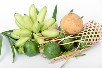 Banana, santol and bergamot on a white background