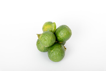 kaffir lime balls on a white scene