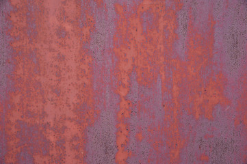 Abstract background. Rust on the pink and lilac painted metal surface. Background, structure.